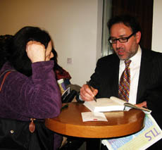 Khaled signing his book